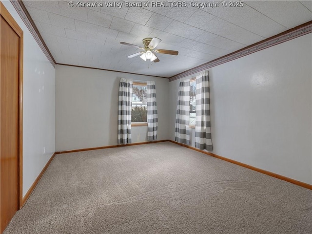 spare room with ornamental molding, carpet flooring, and ceiling fan