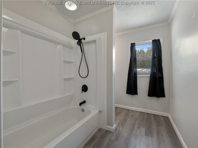 bathroom with crown molding, tub / shower combination, and hardwood / wood-style floors