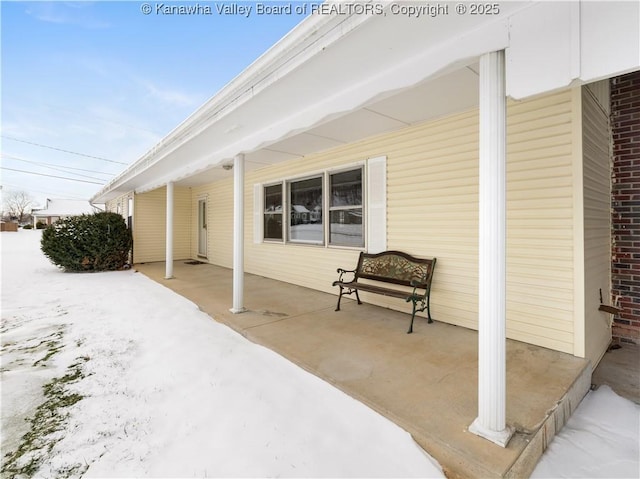 view of snow covered patio