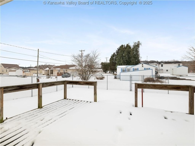 view of yard layered in snow