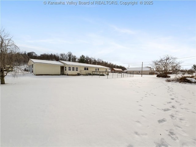 view of yard layered in snow