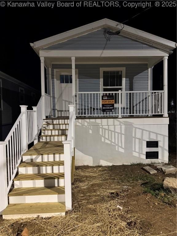 doorway to property featuring a porch