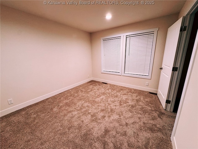 empty room featuring carpet