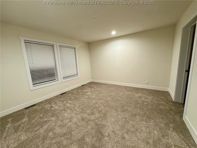 unfurnished bedroom featuring dark carpet