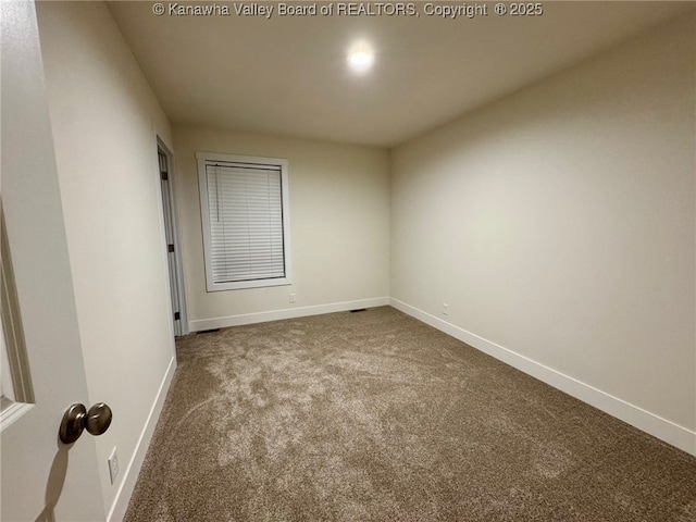 unfurnished room with carpet flooring