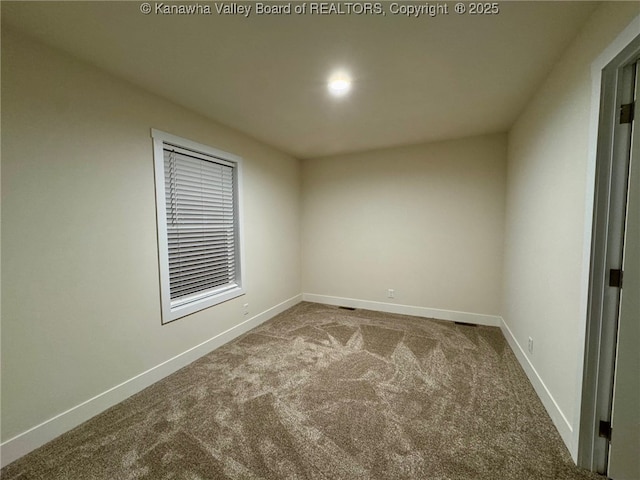 spare room with carpet floors