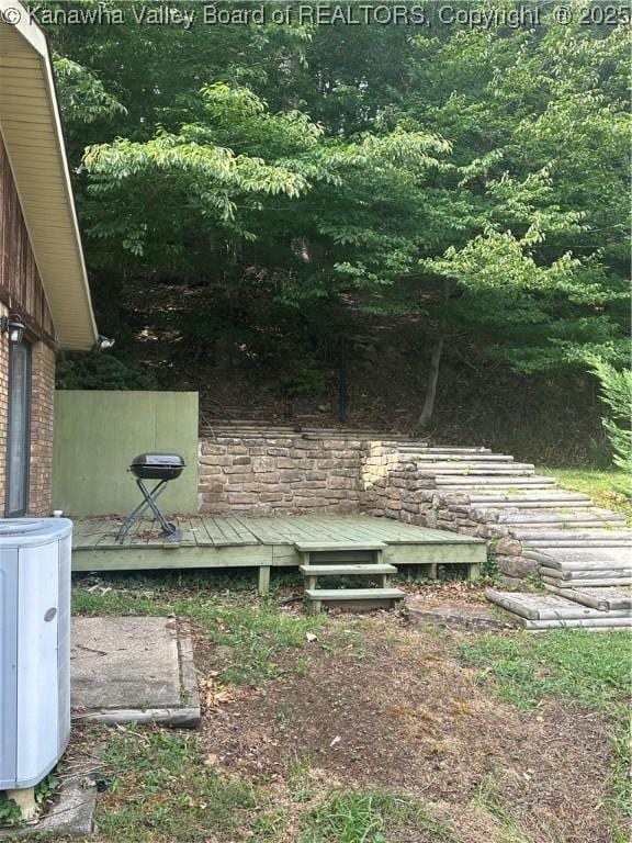 view of yard featuring a wooden deck