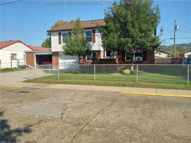 view of front of property with a garage and a front yard