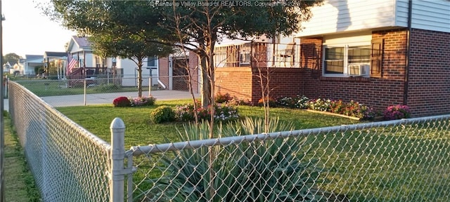 view of side of property with cooling unit and a lawn