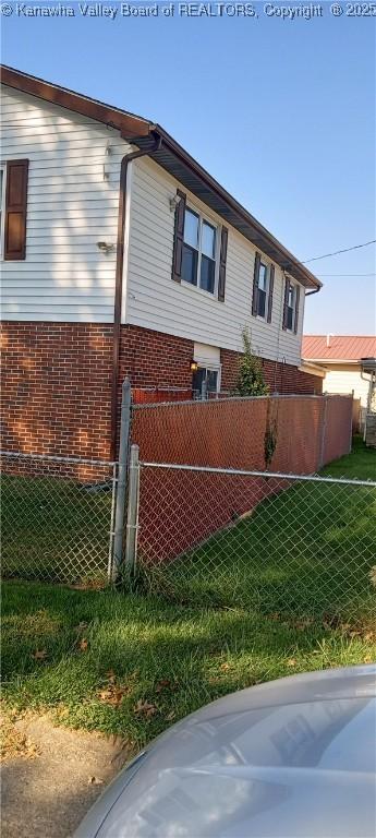 view of home's exterior featuring a lawn