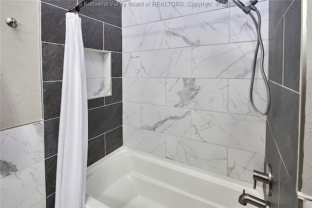 bathroom featuring shower / bathtub combination with curtain