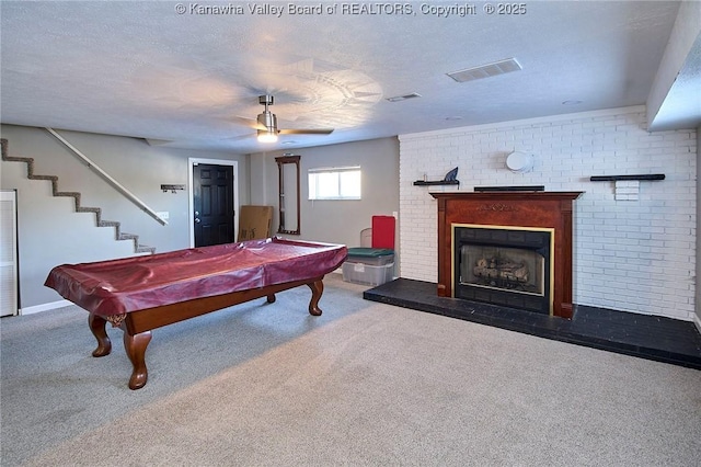 game room featuring brick wall, billiards, carpet flooring, ceiling fan, and a textured ceiling