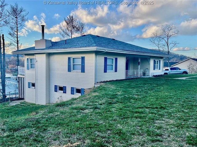 back of house with a yard