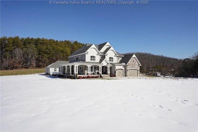 view of front of home with a garage and a porch