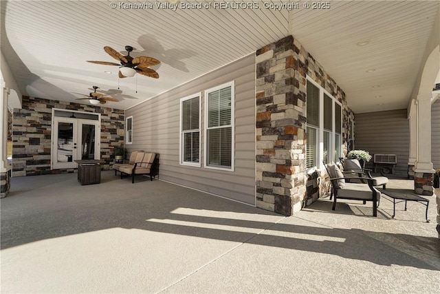 view of patio featuring ceiling fan