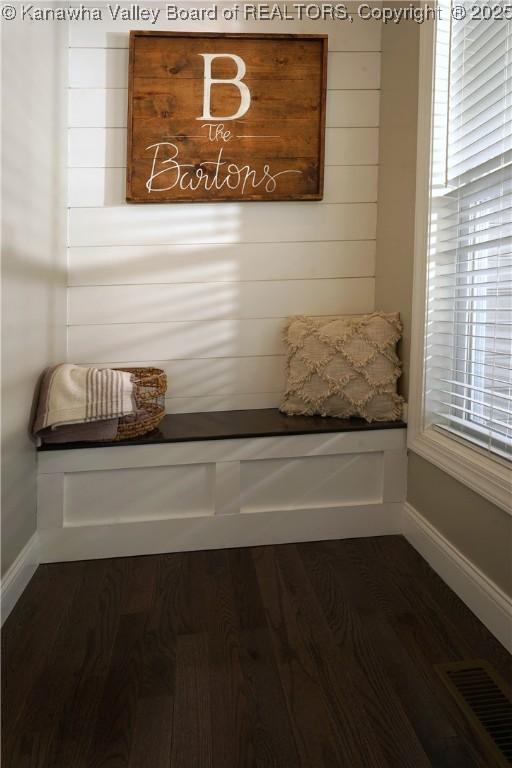 mudroom with dark wood-type flooring