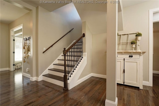 stairway with hardwood / wood-style flooring