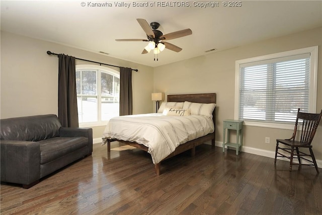 bedroom with dark wood-type flooring and ceiling fan