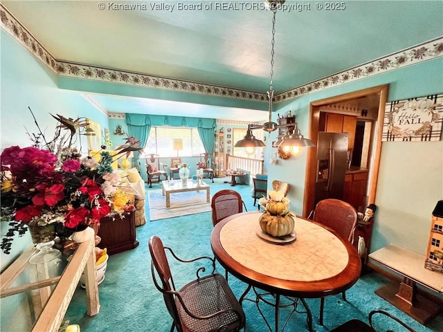 view of carpeted dining room