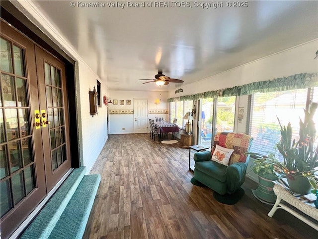 sunroom / solarium with ceiling fan and french doors