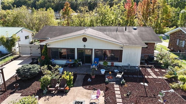 rear view of property featuring a patio area