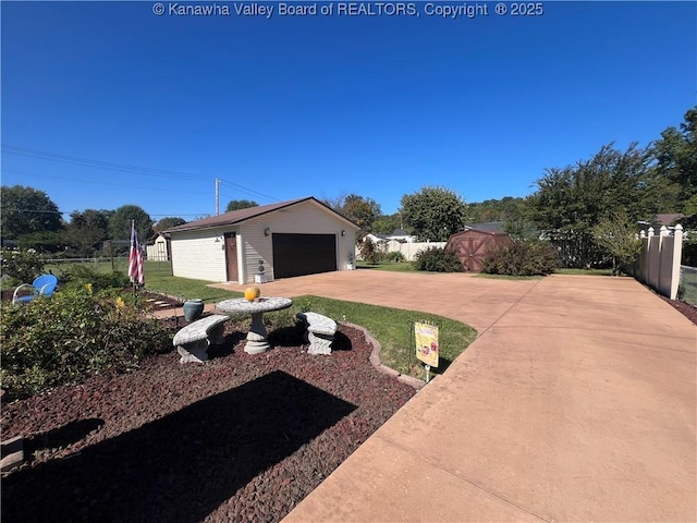 view of yard with a storage shed and a garage