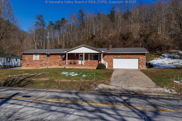 ranch-style home with a porch, a garage, and a front lawn