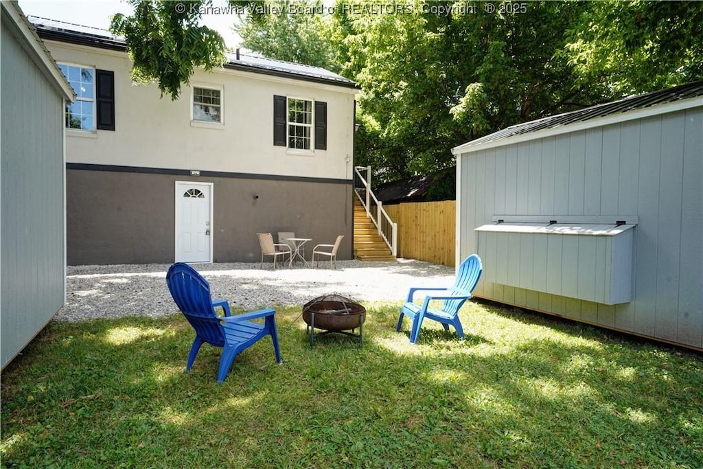 exterior space with an outdoor fire pit