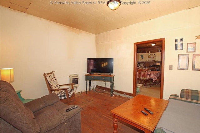 living room featuring hardwood / wood-style floors and heating unit