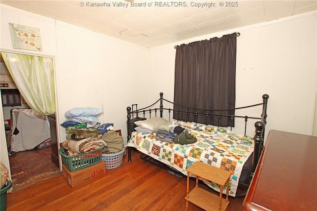 bedroom featuring hardwood / wood-style floors