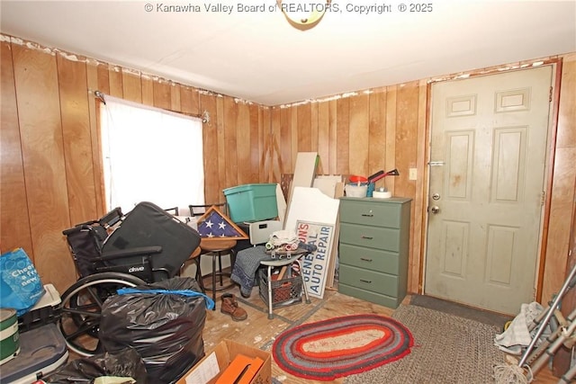 miscellaneous room with wooden walls