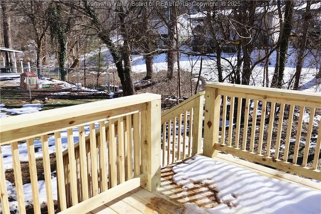 view of snow covered deck