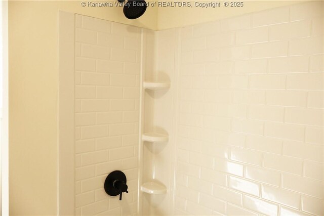 room details with a tile shower