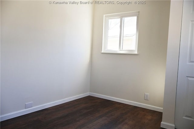 spare room featuring dark hardwood / wood-style flooring