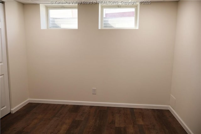 unfurnished room featuring dark hardwood / wood-style flooring