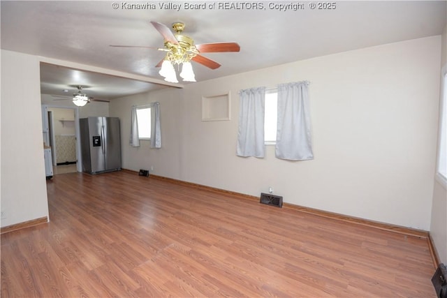 unfurnished room with ceiling fan and wood-type flooring