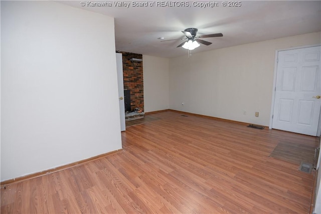 unfurnished room featuring ceiling fan and light hardwood / wood-style floors