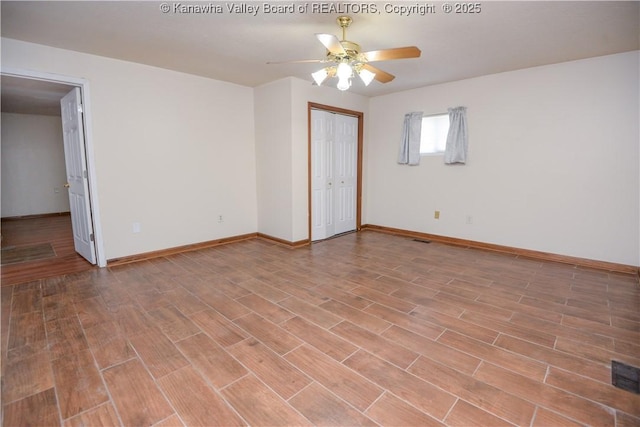 unfurnished room with ceiling fan