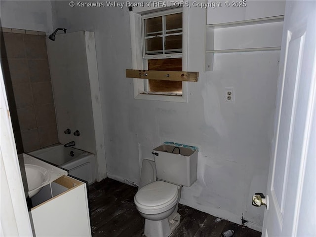 full bathroom with vanity, hardwood / wood-style floors, tiled shower / bath combo, and toilet