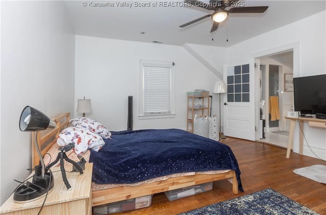 bedroom with dark wood-type flooring and ceiling fan