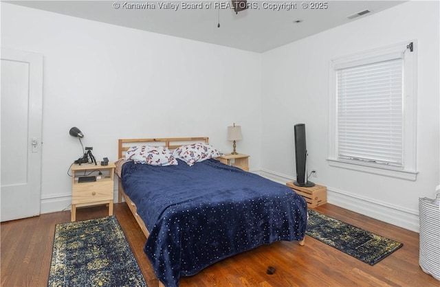 bedroom featuring dark hardwood / wood-style floors