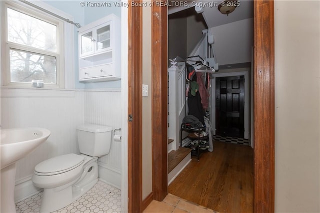 bathroom featuring sink, tile patterned floors, and toilet