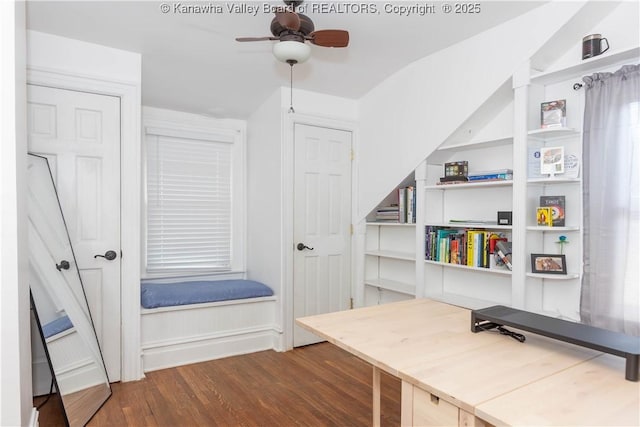 home office featuring dark hardwood / wood-style floors and ceiling fan