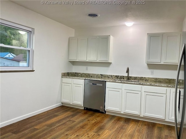 kitchen featuring sink, dishwasher, white cabinetry, light stone countertops, and dark hardwood / wood-style flooring