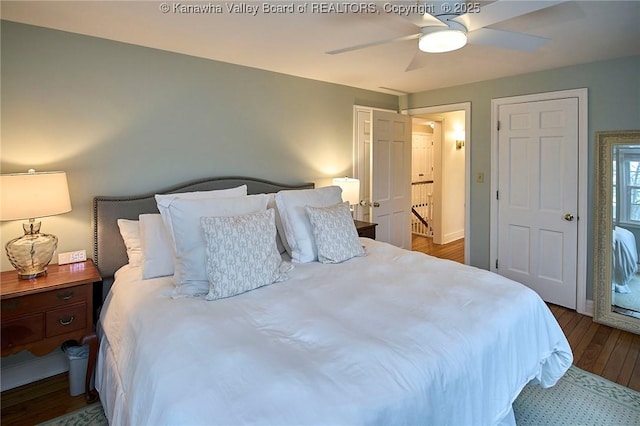 bedroom with wood-type flooring and ceiling fan