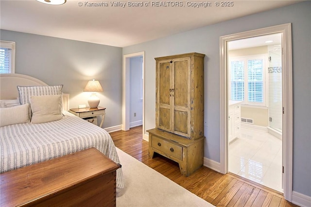 bedroom with wood-type flooring