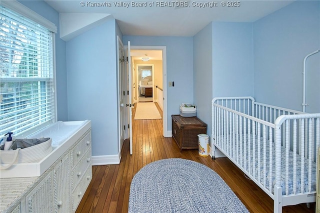 bedroom featuring dark hardwood / wood-style flooring