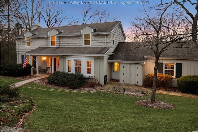 view of front of property with a yard