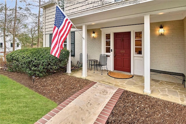 property entrance featuring covered porch