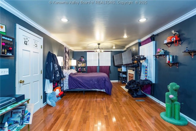 bedroom with ornamental molding and wood-type flooring